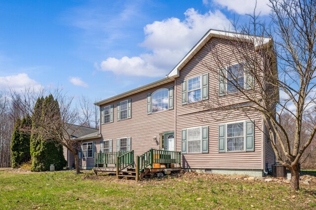 57480 72nd Ave, Hartford, MI 49057 - rear view of property featuring a deck, central AC unit, and a lawn