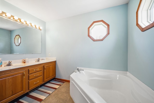 57480 72nd Ave, Hartford, MI 49057 - full bath with a sink, baseboards, double vanity, and a garden tub