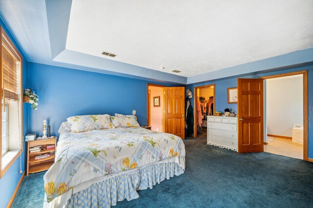 57480 72nd Ave, Hartford, MI 49057 - carpeted bedroom with visible vents, a spacious closet, a closet, and baseboards