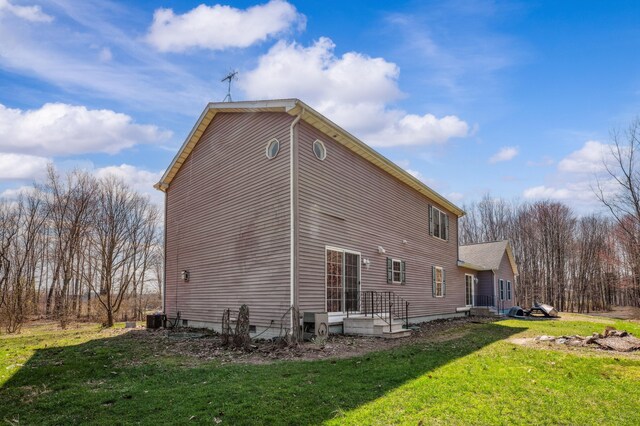 57480 72nd Ave, Hartford, MI 49057 - view of side of property featuring a yard and central AC unit