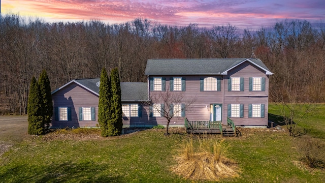 57480 72nd Ave, Hartford, MI 49057 - colonial house with a wooded view and a front lawn