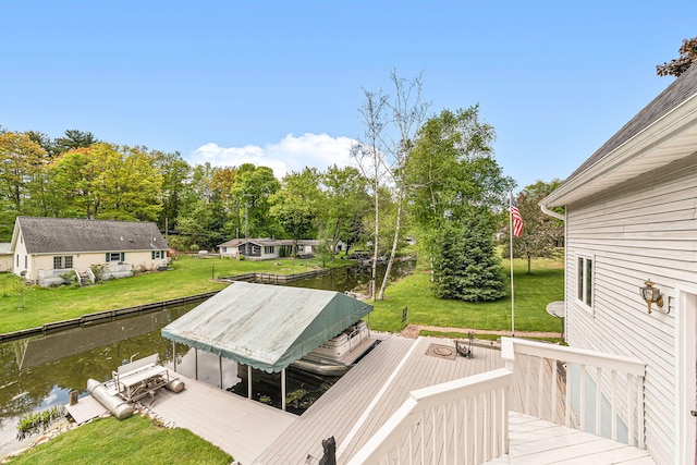 5095 Bliss Ln, Newaygo, MI 49337 - deck featuring a water view, a yard, a dock, and boat lift