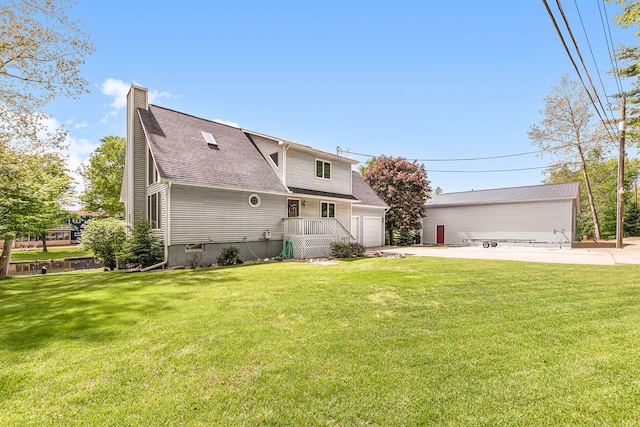 5095 Bliss Ln, Newaygo, MI 49337 - view of front facade featuring a front lawn, a shingled roof, a garage, and a chimney