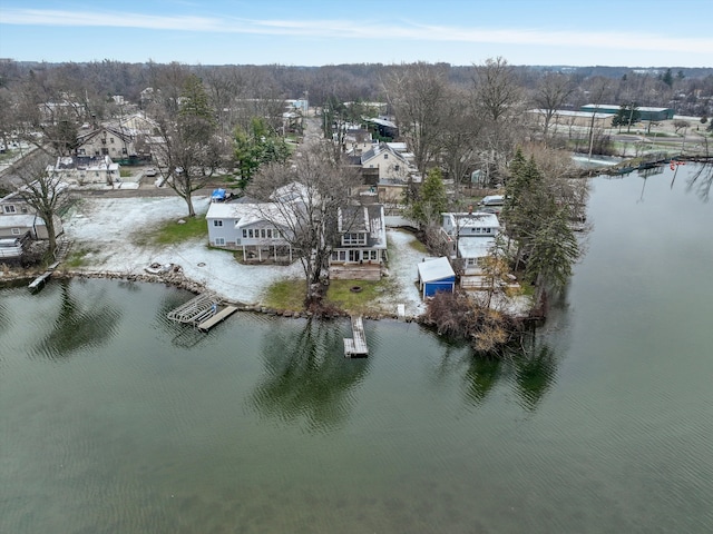 birds eye view of property featuring a residential view and a water view