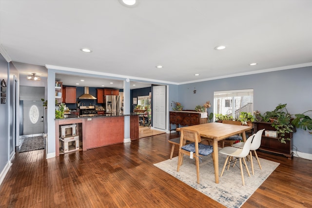 dining space featuring recessed lighting, baseboards, ornamental molding, and dark wood finished floors
