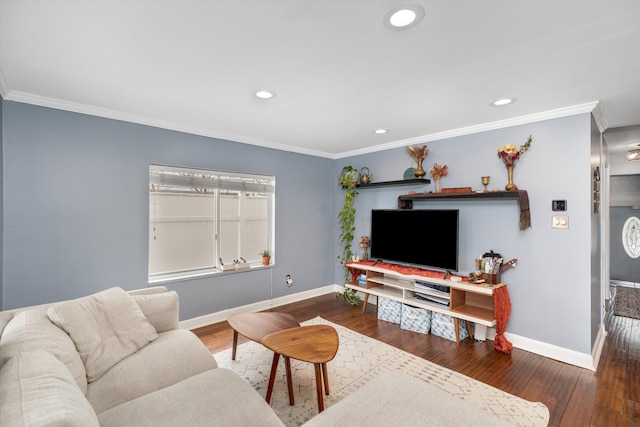 living area with crown molding, baseboards, and hardwood / wood-style floors