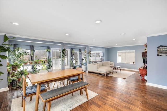 dining room featuring crown molding, baseboards, and recessed lighting