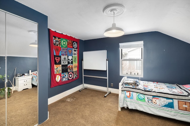 carpeted bedroom with baseboards and vaulted ceiling