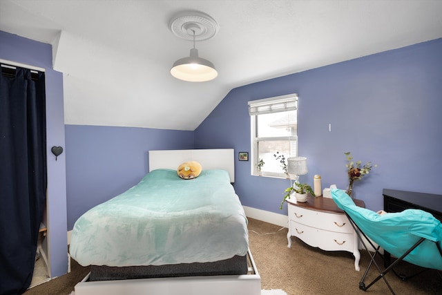 bedroom with baseboards, carpet, and vaulted ceiling