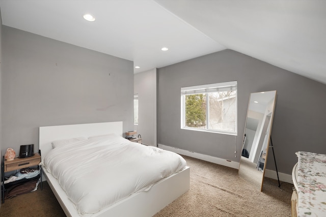 bedroom with light carpet, recessed lighting, baseboards, and vaulted ceiling