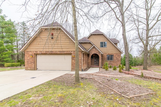 craftsman house featuring brick siding, a garage, and concrete driveway