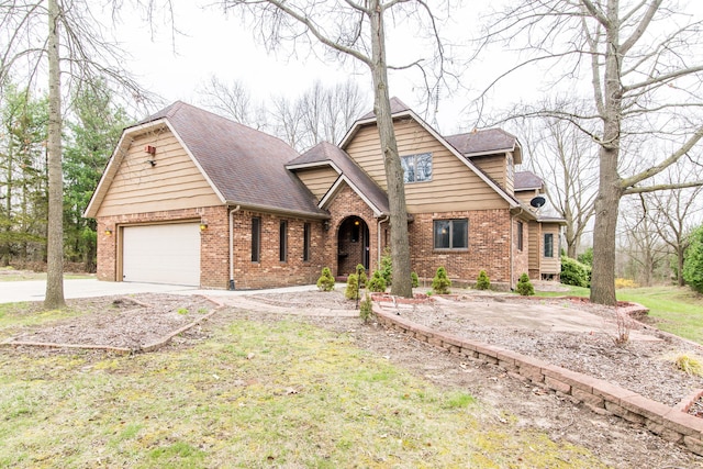 view of front of house with concrete driveway, roof with shingles, brick siding, and a garage