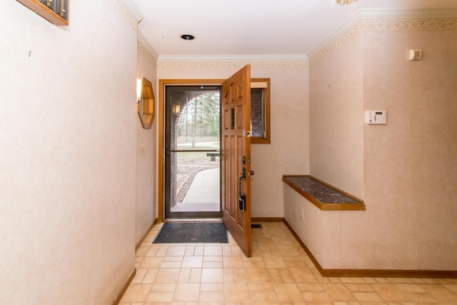 entryway featuring crown molding