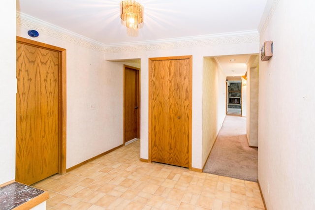 unfurnished room with crown molding and baseboards