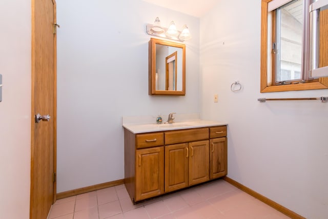 bathroom with vanity and baseboards
