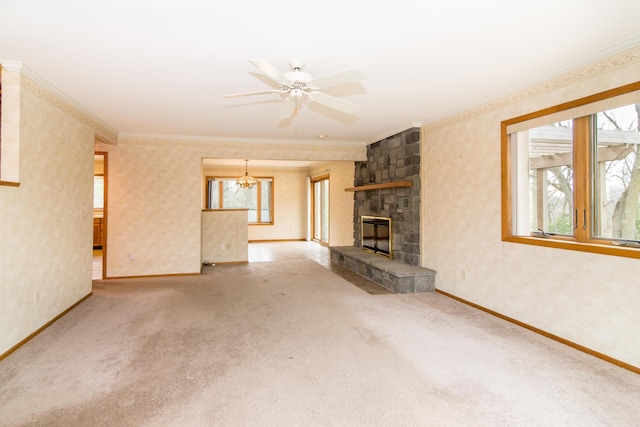 unfurnished living room with carpet flooring, baseboards, ornamental molding, and a stone fireplace