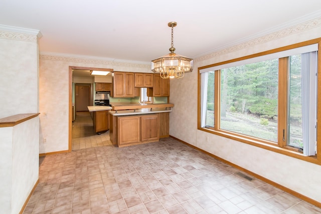 kitchen with wallpapered walls and baseboards