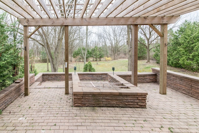 view of patio with an outdoor fire pit and a pergola