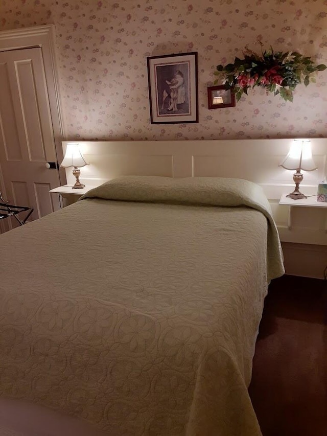 bedroom featuring wallpapered walls