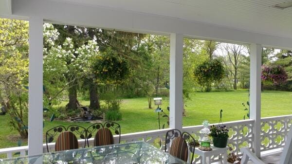 sunroom with outdoor dining space
