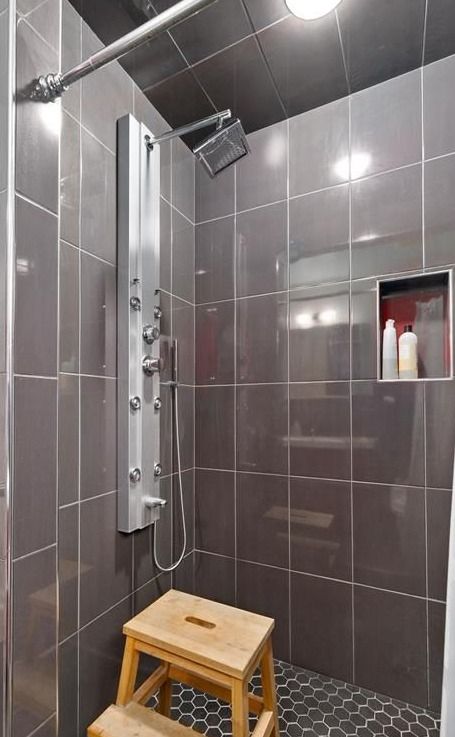 full bathroom with tile walls and tiled shower