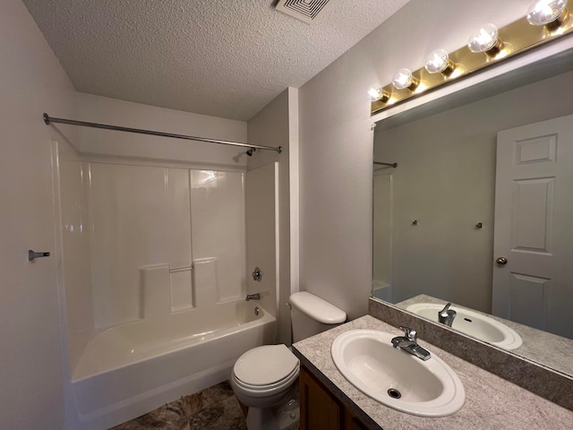 bathroom featuring a textured ceiling, visible vents, toilet, shower / washtub combination, and vanity