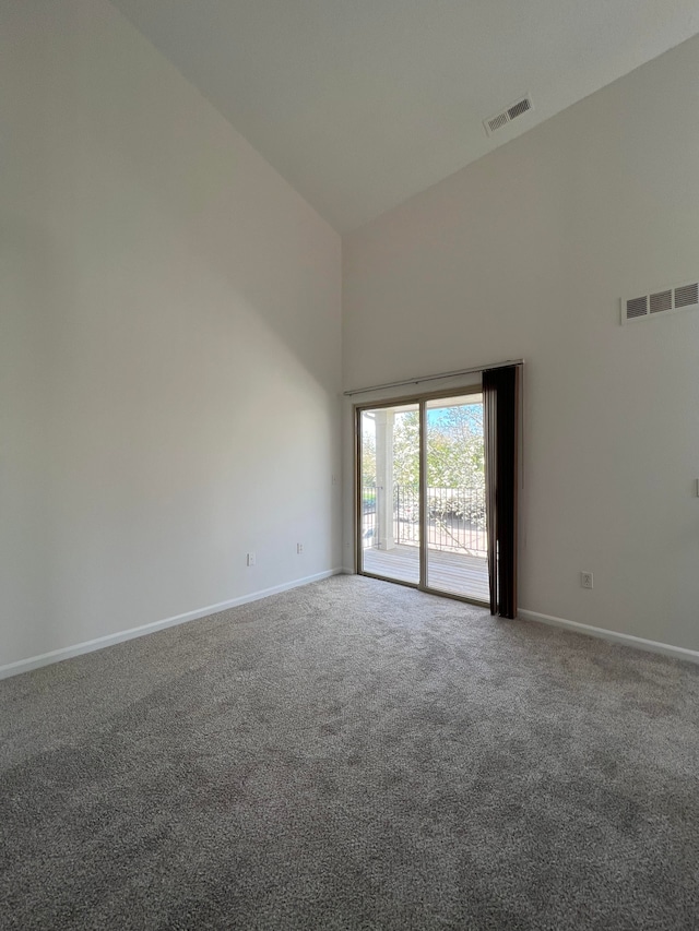 12201 Pinehurst Ln, Grand Blanc, MI 48439 - carpeted spare room with a towering ceiling and baseboards