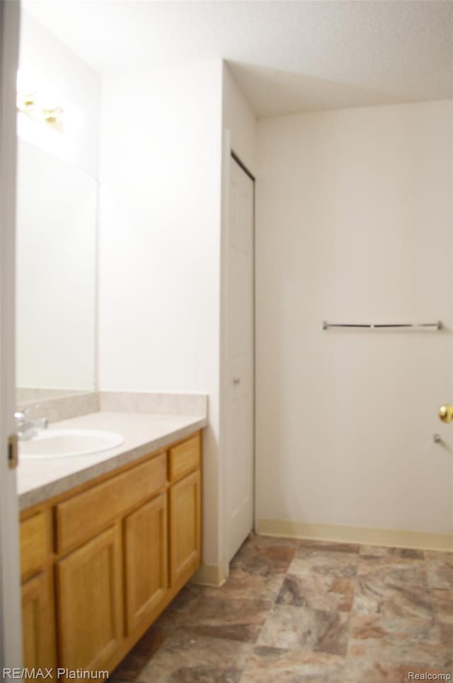 12201 Pinehurst Ln, Grand Blanc, MI 48439 - bathroom featuring vanity and stone finish flooring