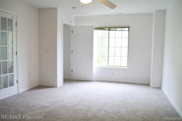12201 Pinehurst Ln, Grand Blanc, MI 48439 - carpeted empty room with plenty of natural light, a ceiling fan, and baseboards