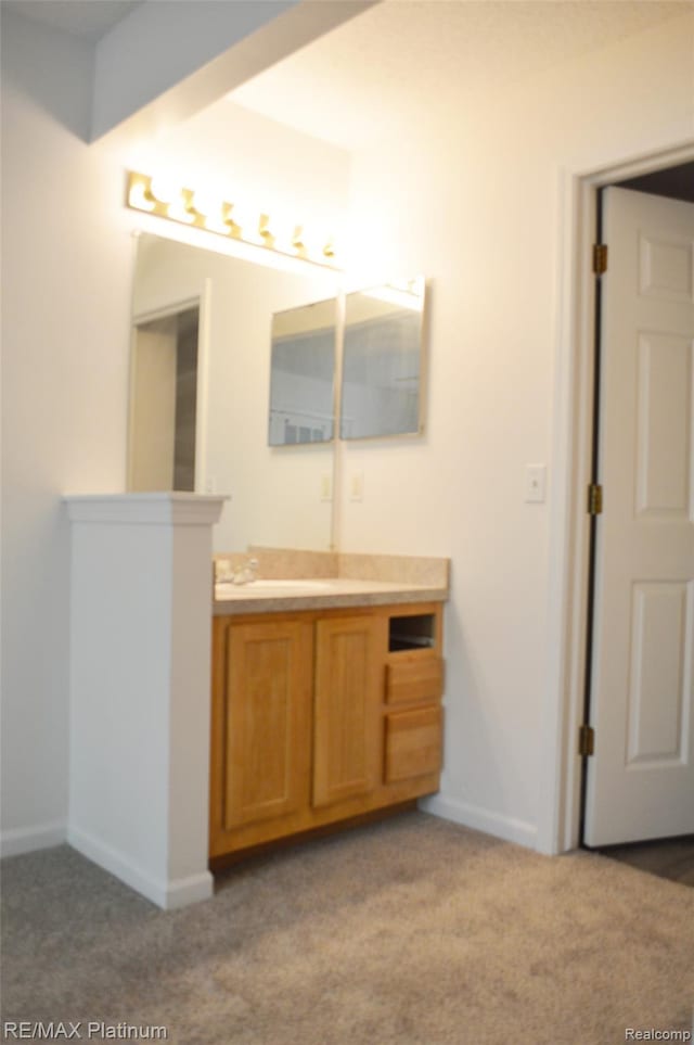 12201 Pinehurst Ln, Grand Blanc, MI 48439 - bathroom featuring vanity, baseboards, and carpet floors