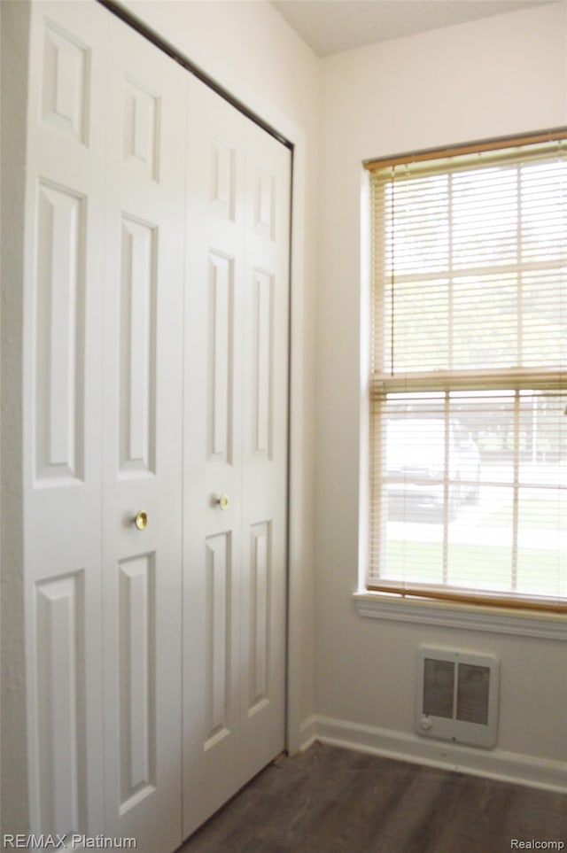 12201 Pinehurst Ln, Grand Blanc, MI 48439 - unfurnished bedroom with baseboards, a closet, and dark wood-style floors