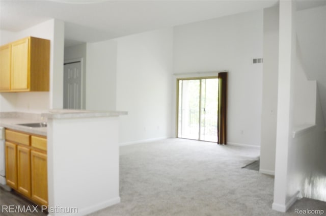 12201 Pinehurst Ln, Grand Blanc, MI 48439 - kitchen featuring open floor plan, carpet, light countertops, and baseboards