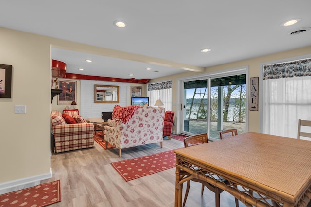 dining space featuring light wood-style flooring, visible vents, and recessed lighting