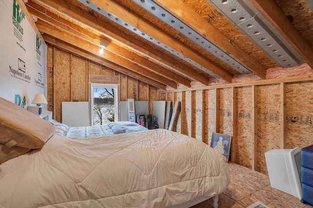 bedroom featuring lofted ceiling