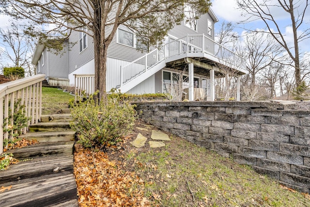 rear view of house featuring stairs