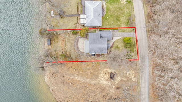 birds eye view of property featuring a water view