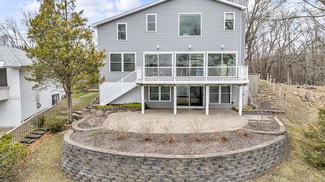back of house with a patio area and stairway