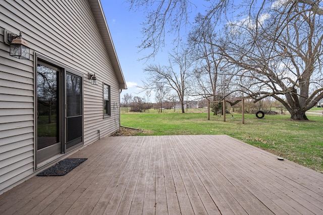 wooden terrace with a lawn