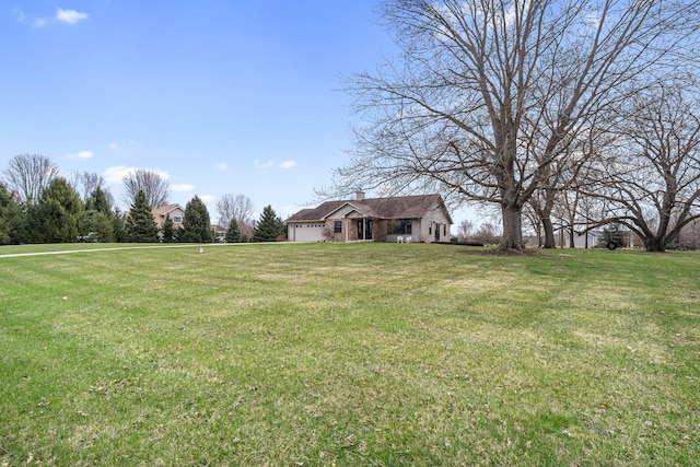 view of yard featuring a garage
