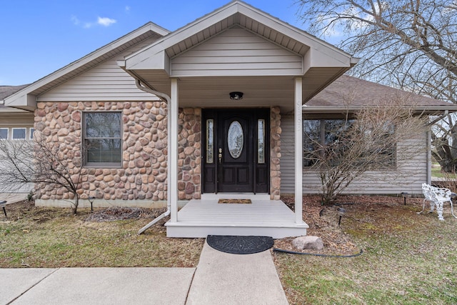 property entrance with stone siding