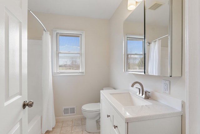 full bathroom featuring a wealth of natural light, vanity, and visible vents