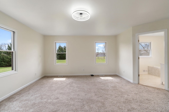 unfurnished bedroom featuring carpet floors and baseboards