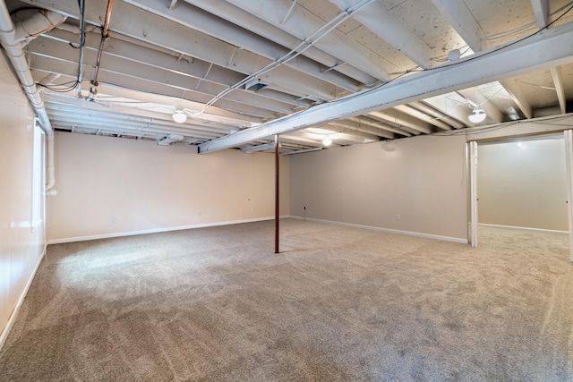 finished below grade area with baseboards and carpet