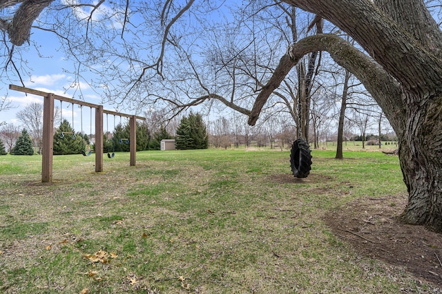 view of yard with a storage shed and an outdoor structure