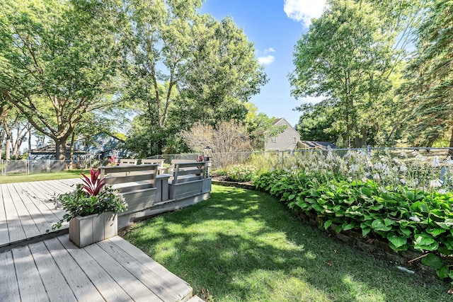 view of yard featuring a fenced backyard and a deck