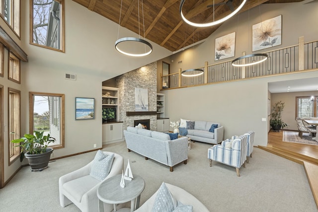 living room with baseboards, visible vents, high vaulted ceiling, carpet, and wood ceiling