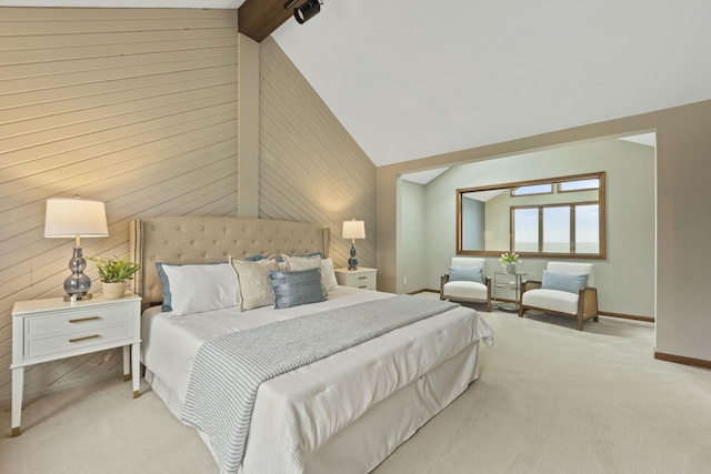 carpeted bedroom with wooden walls, baseboards, and lofted ceiling with beams