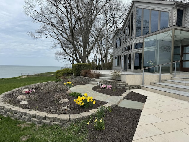 view of yard with a water view