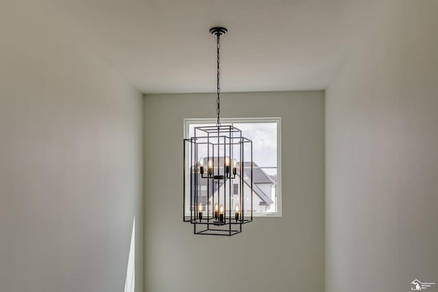 interior details featuring a notable chandelier