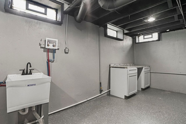 below grade area with a sink